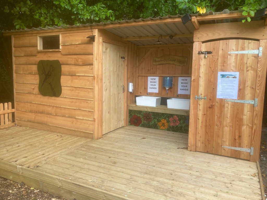 Outdoor compost toilet installation with disabled access for primary school